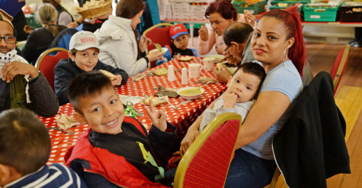Families dining at the community meal